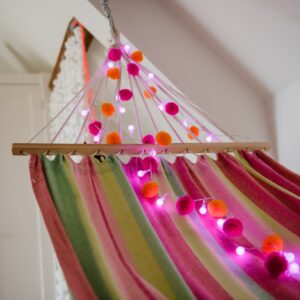 Orange and pink festival pom pom fairy lights with Pink LED lights