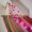 Orange and pink festival pom pom fairy lights with Pink LED lights