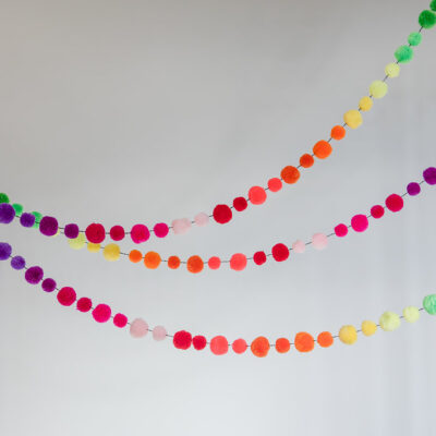 rainbow pom pom garland by pompom galore