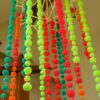 Pom Pom Garlands Hanging with Fluro in the middle