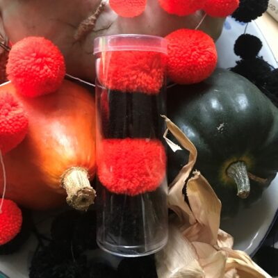 Halloween orange and black pom pom hair bobbles set of 4 in a tube