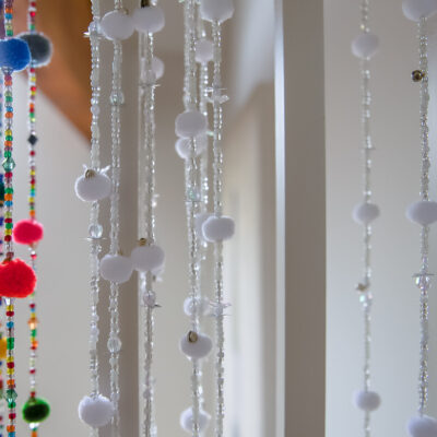 White Bead and Pom pom hanging with bell on end 2